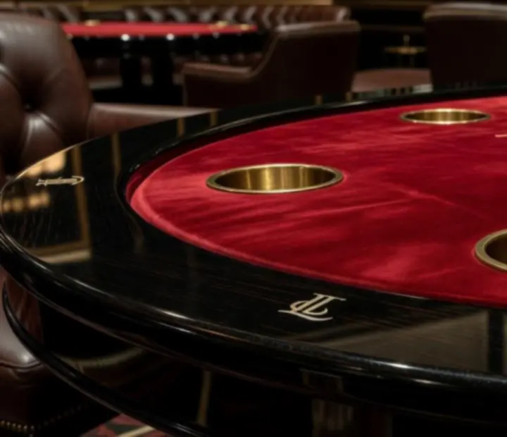 Custom poker table with detailed inlays prepared for a themed social poker night